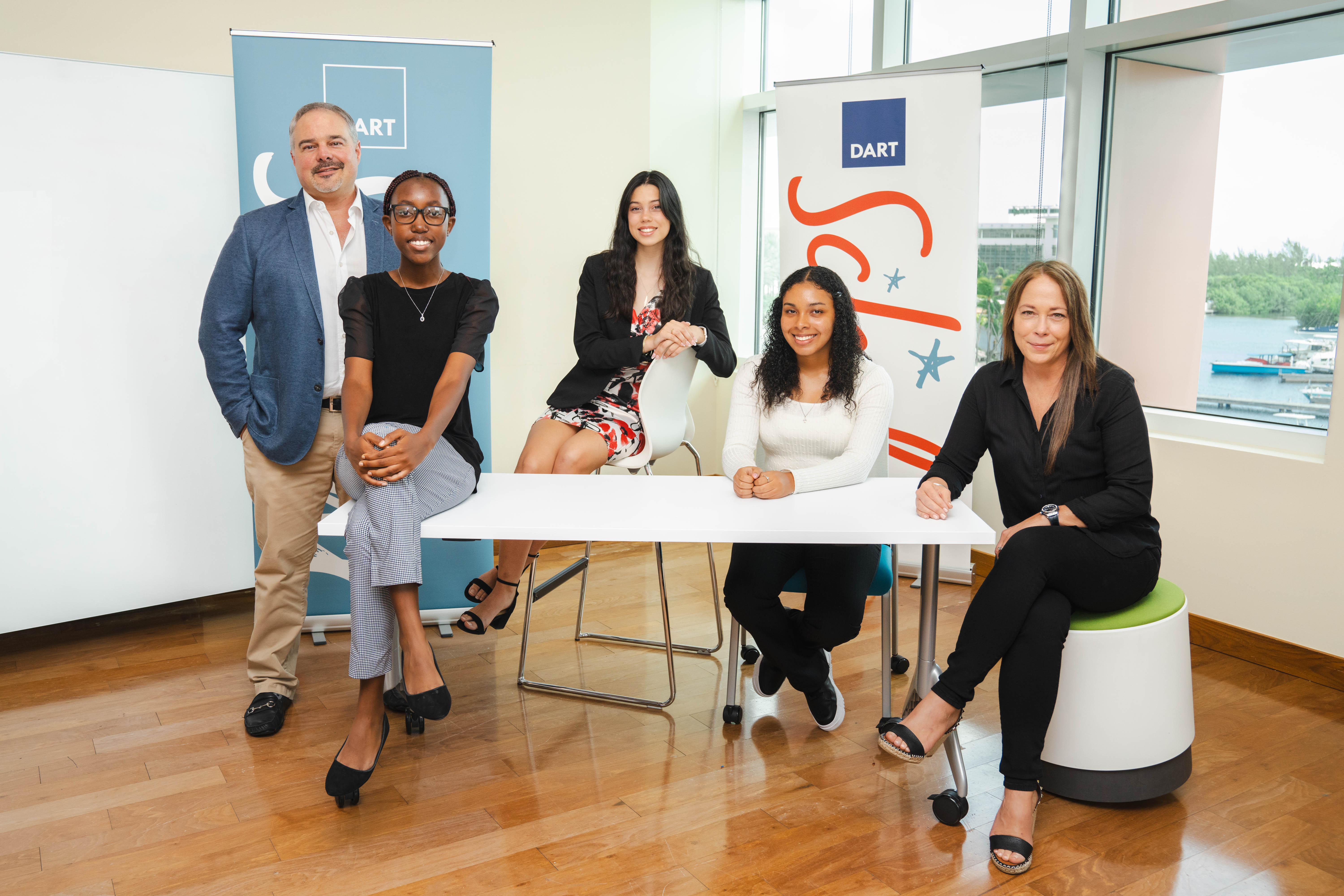 (from left to right) Dart CEO Mark VanDevelde; Dart Scholars Kyla Machingambi, Leila Sulliman-Maw and Alison Owens; and Dart Director Jackie Doak