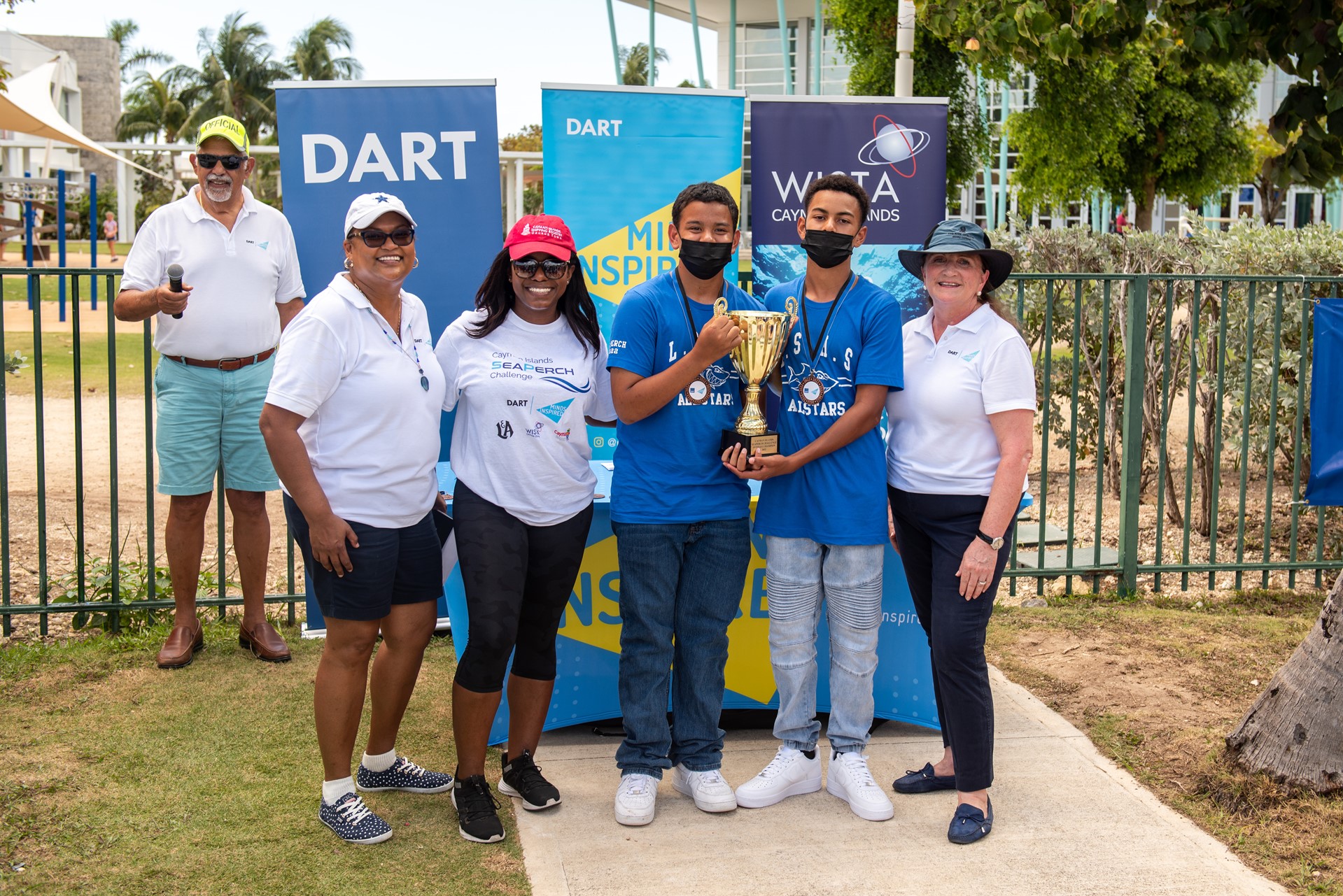 People holding a trophy