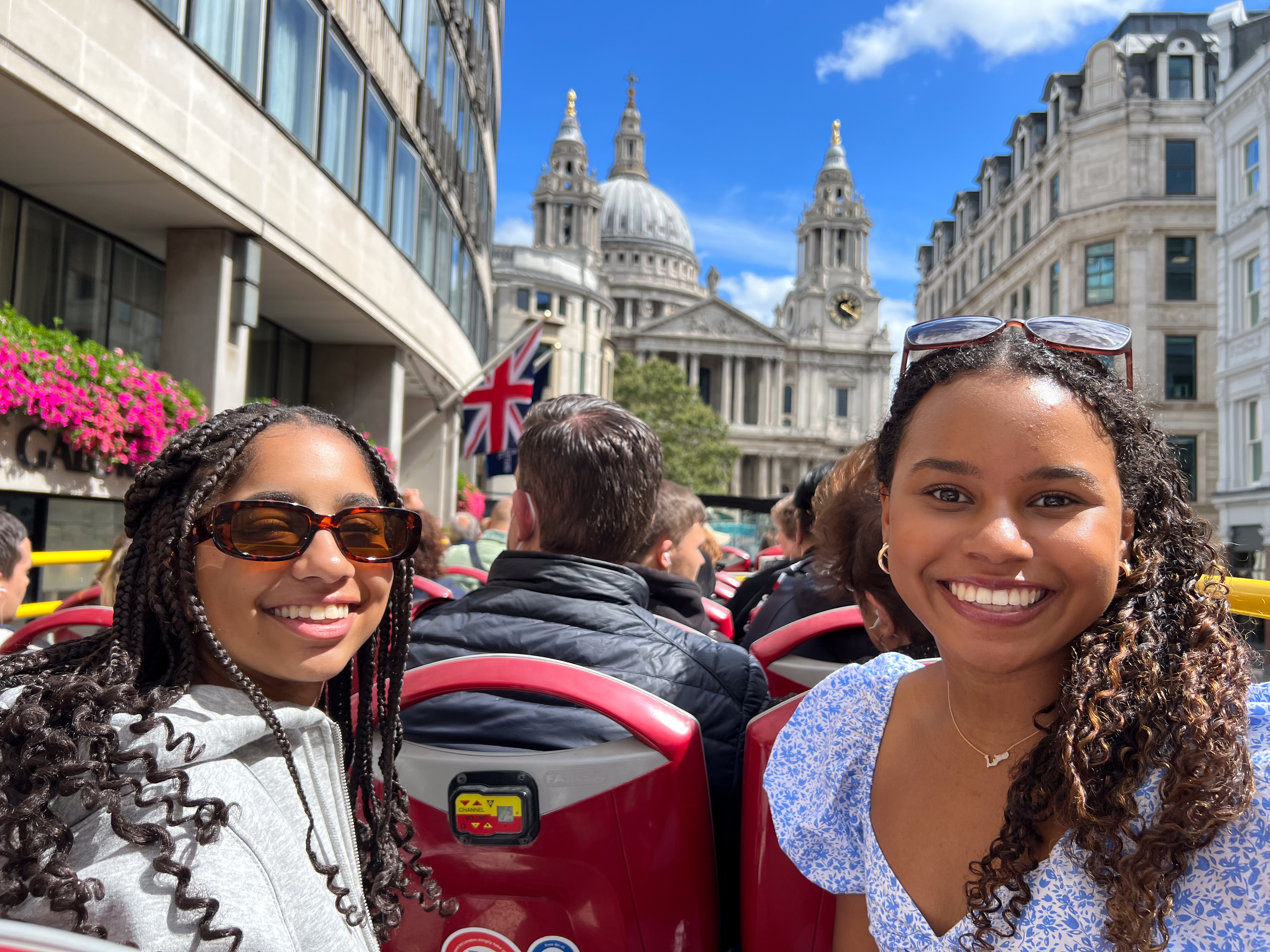 students on open-topped double decker bus