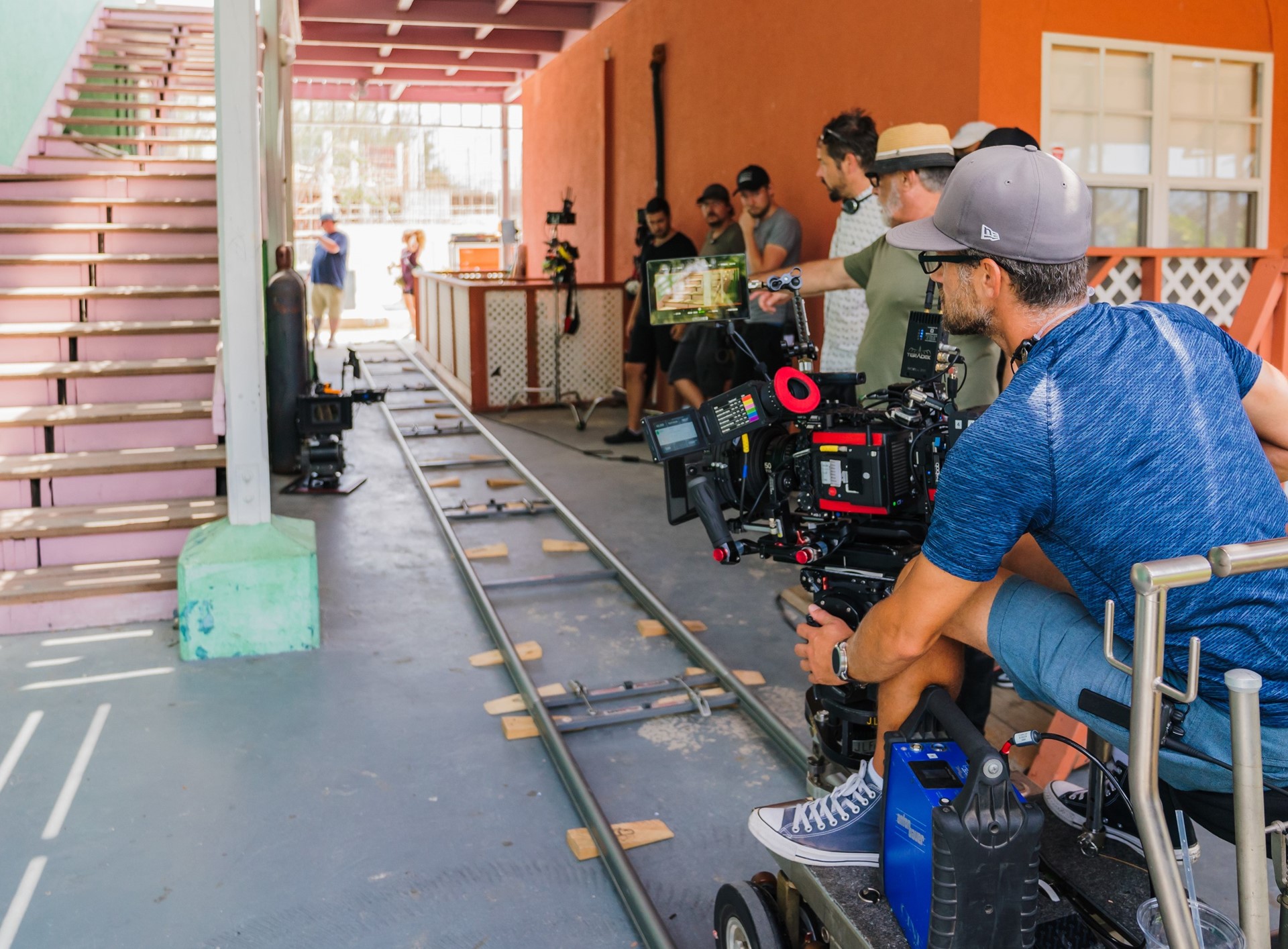 film crew on location by stairs