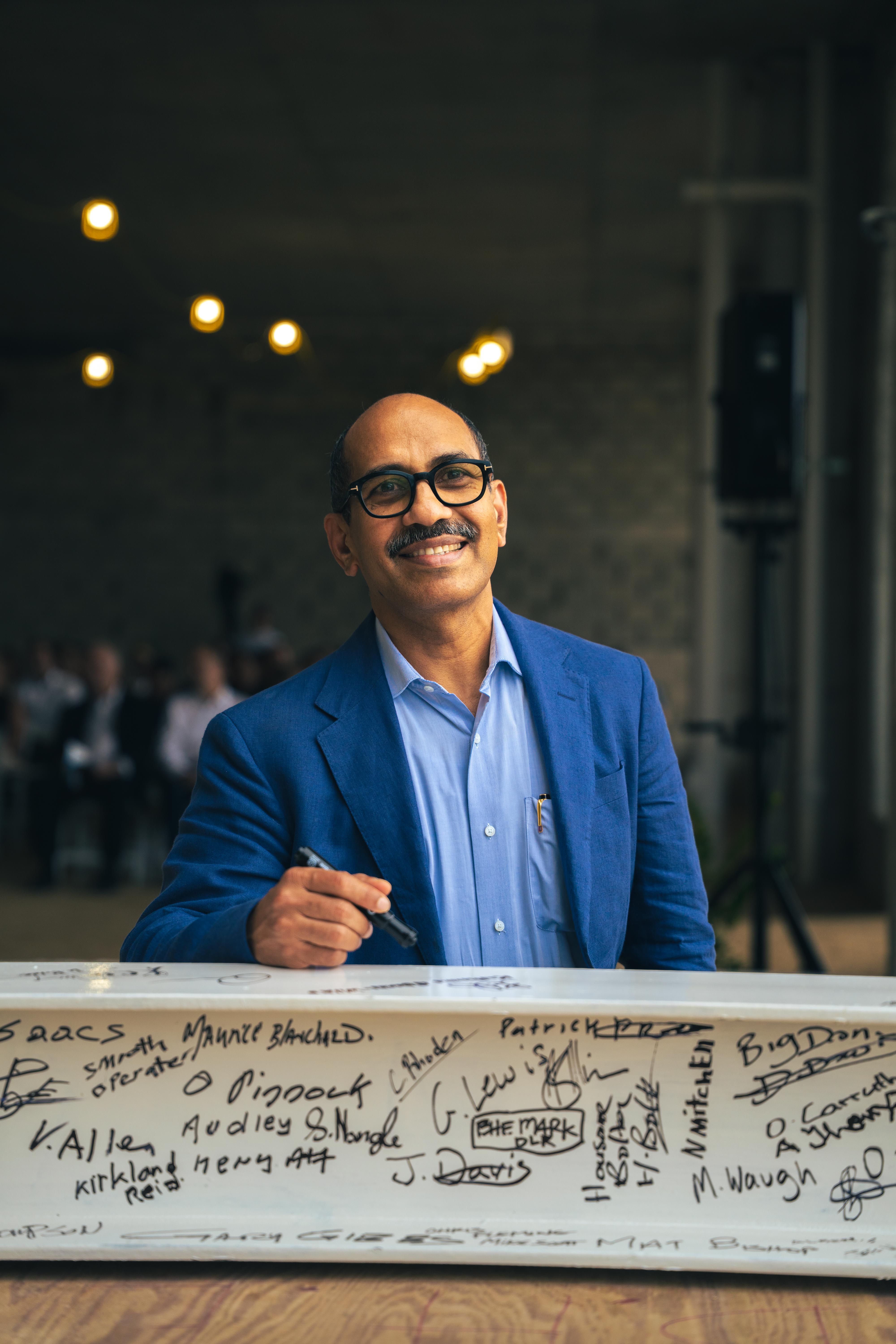 Dr. Binoy, 55 Cerasee Way topping out ceremony