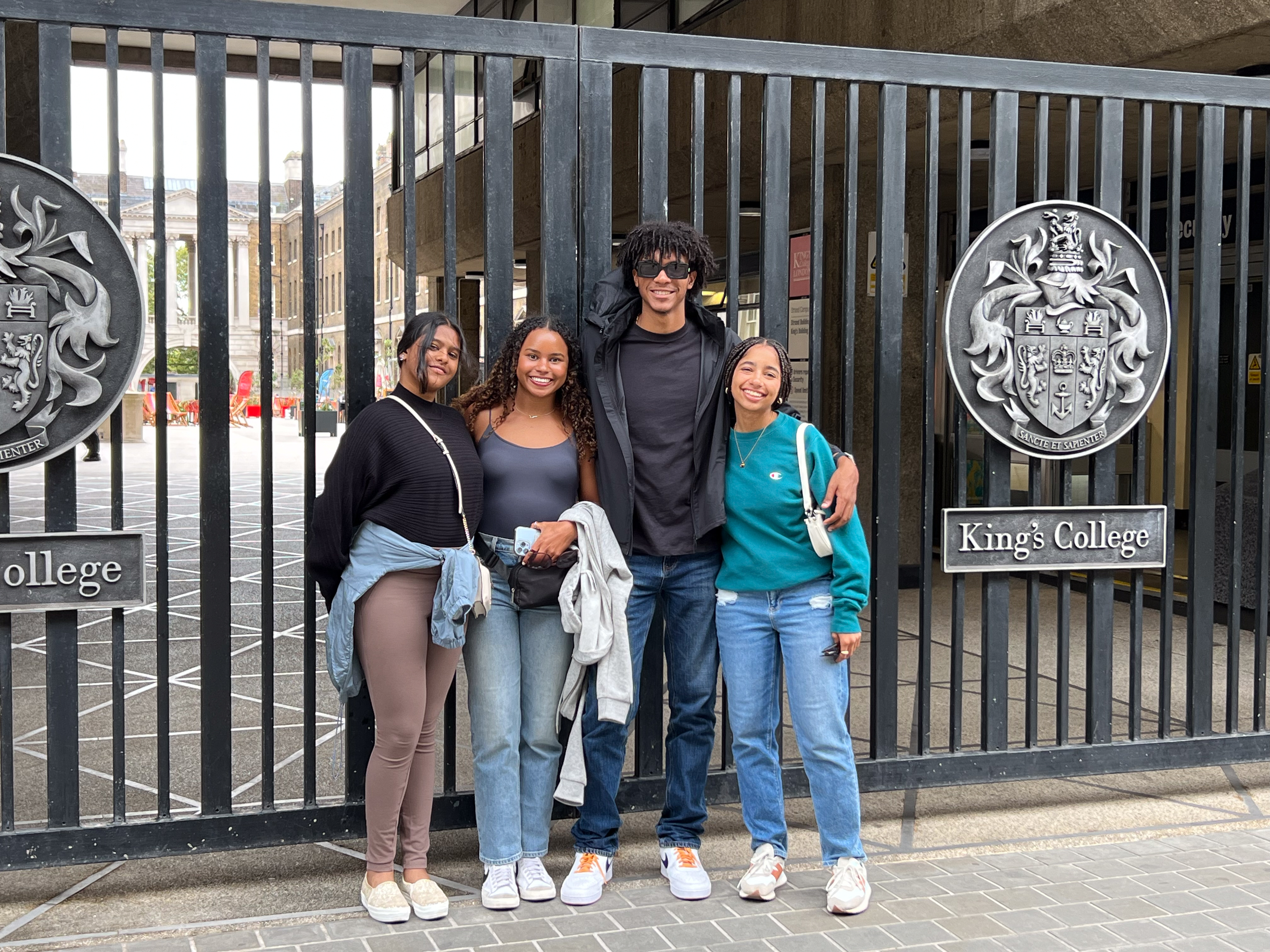 students in front of Kings College gates