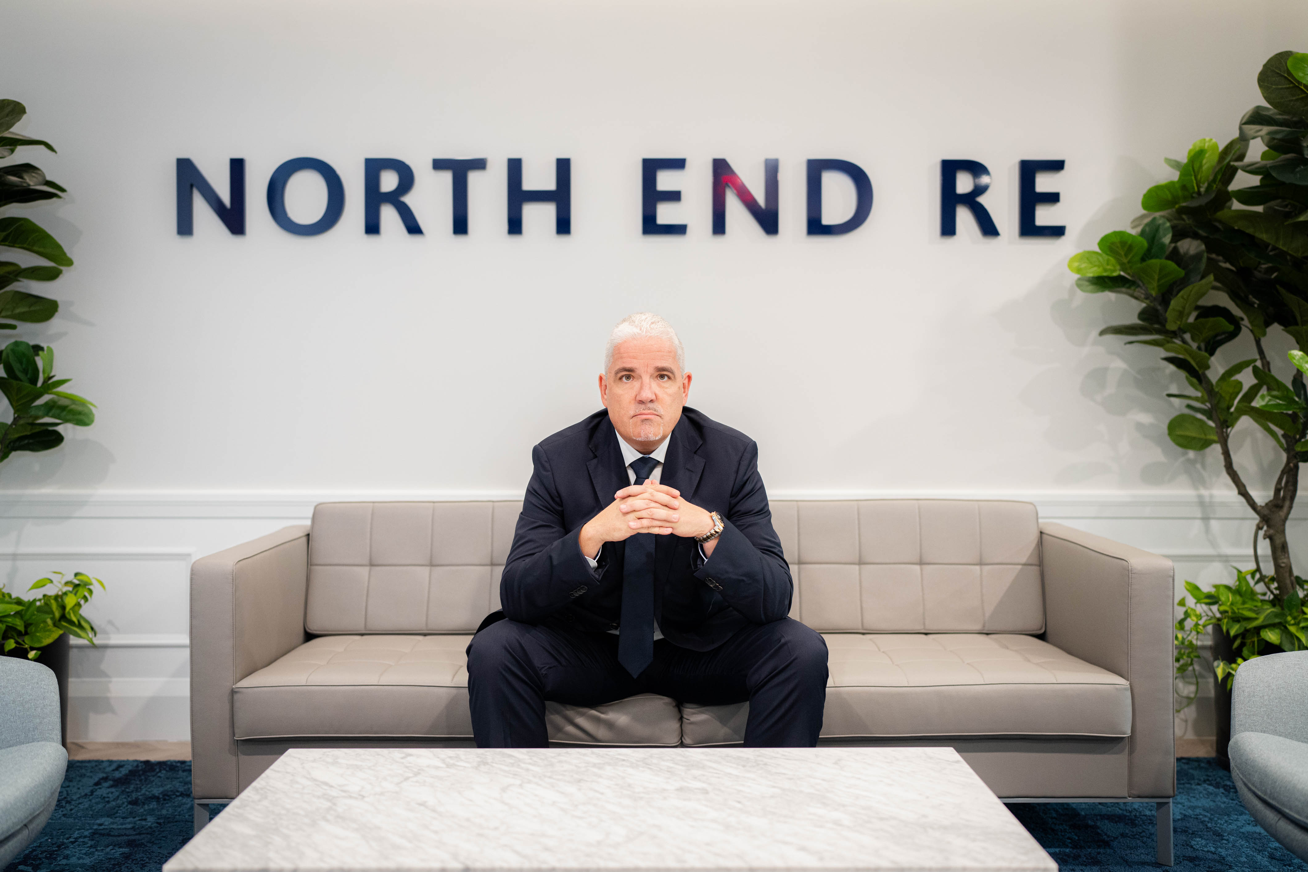 Man poses for camera in lobby