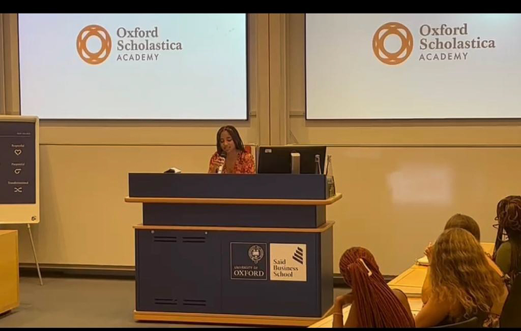 student reading at podium in Oxford Scolastica Academy