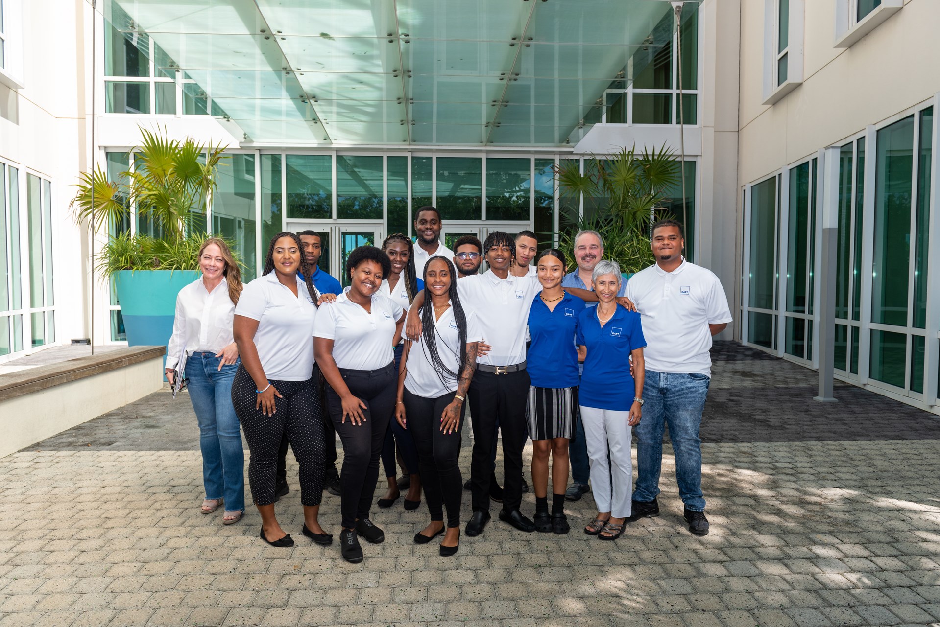 group of graduates in front of Dart offices