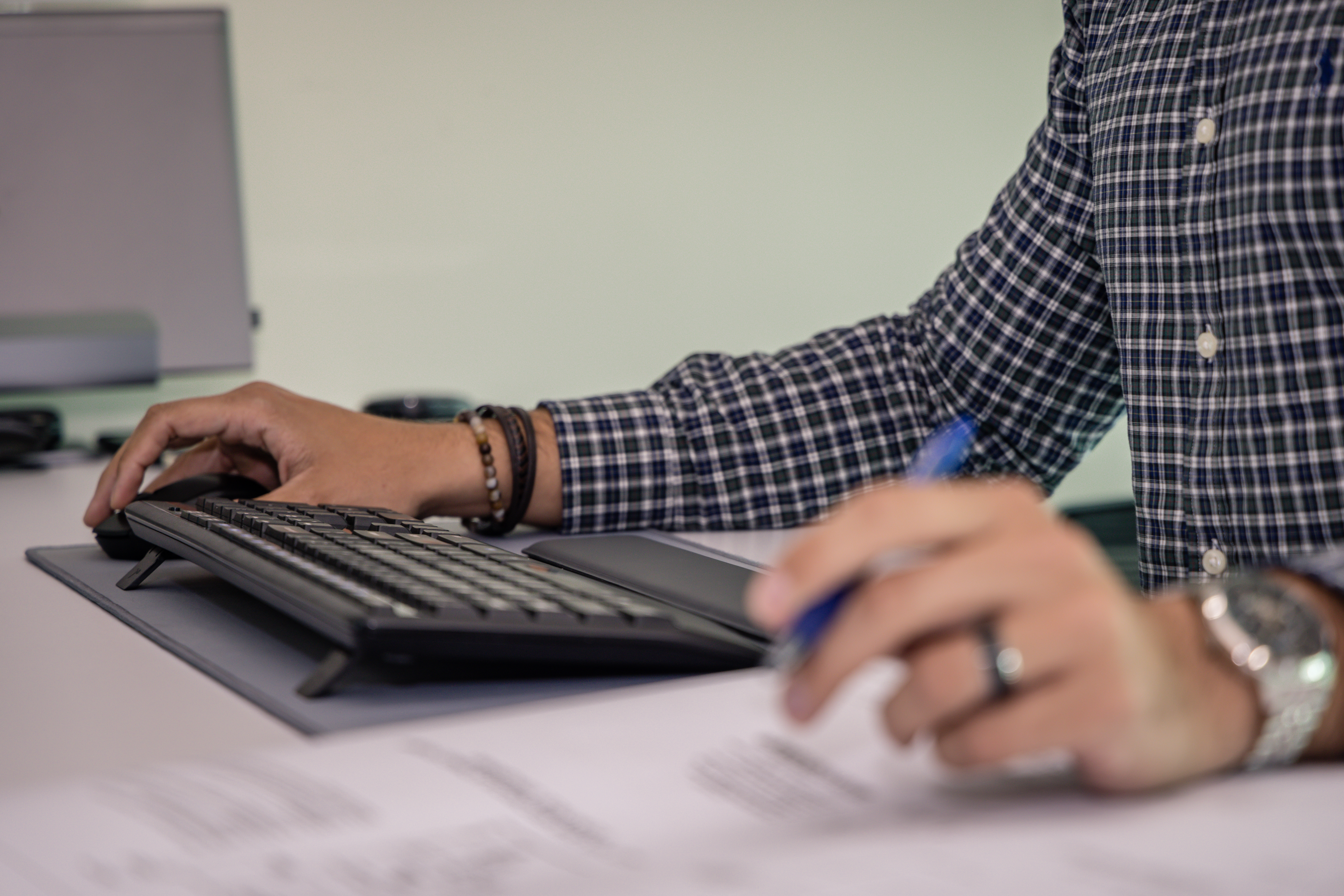 man with computer and notepad