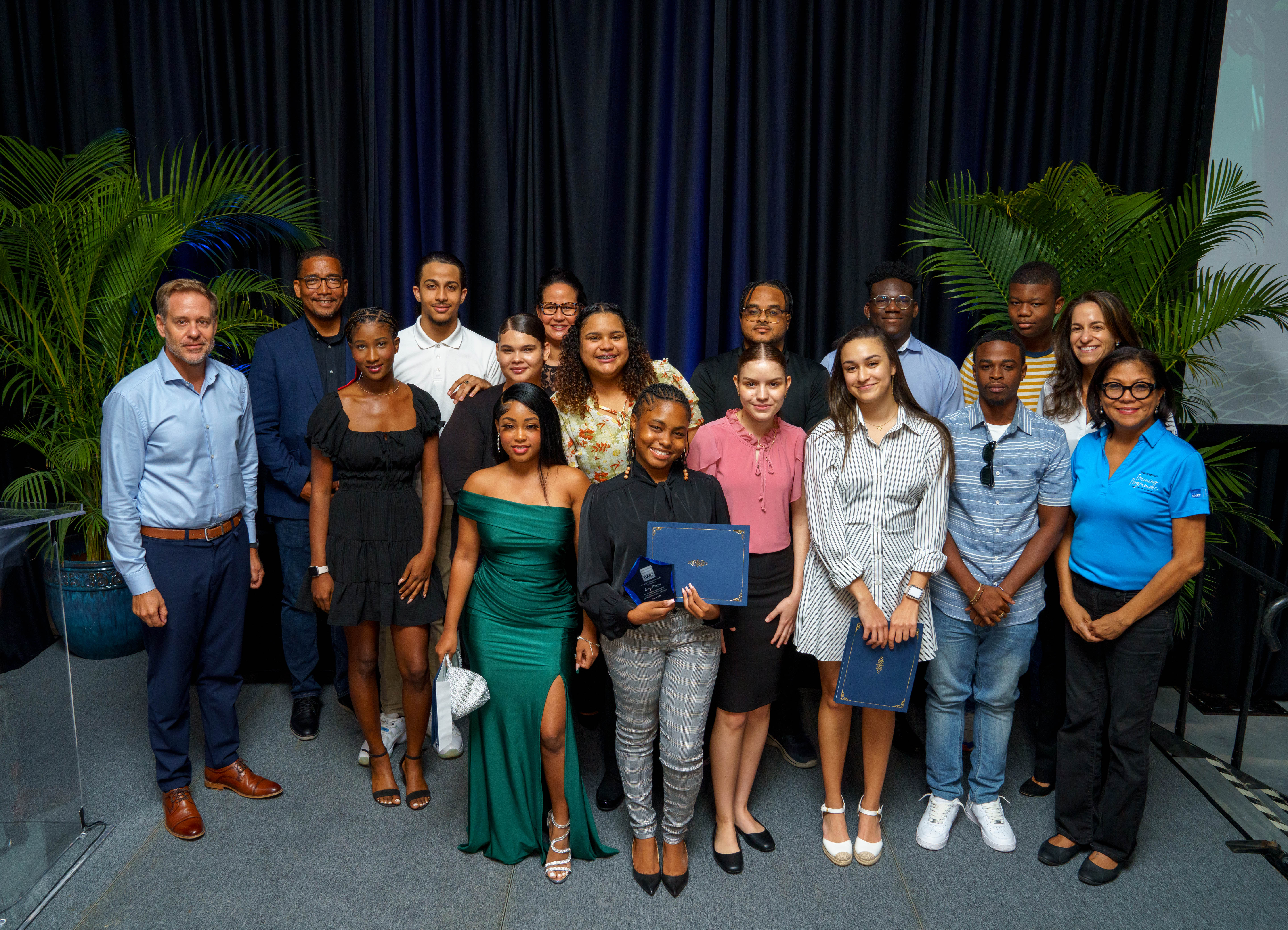 group of graduates with company and government representatives