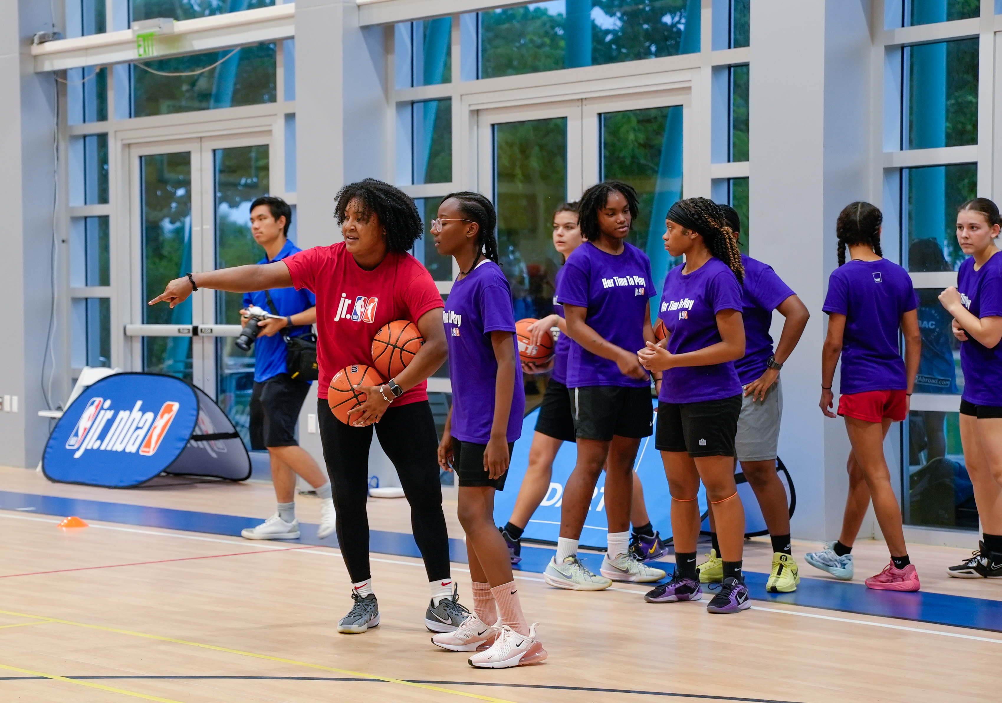 young female athletes participate in Jr WNBA basketball clinic